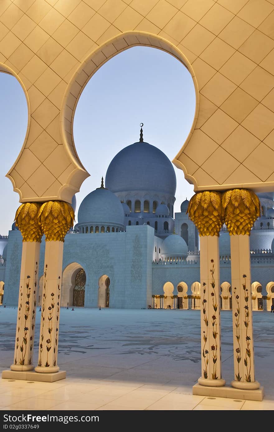 A mosque dome framed by arches