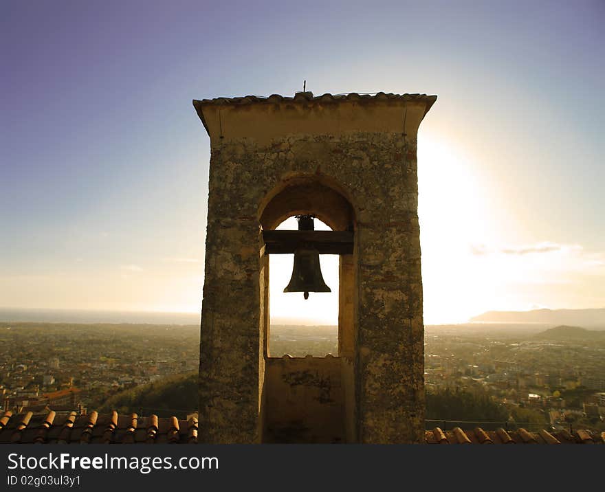 View of an ancient bell tower with view on hills