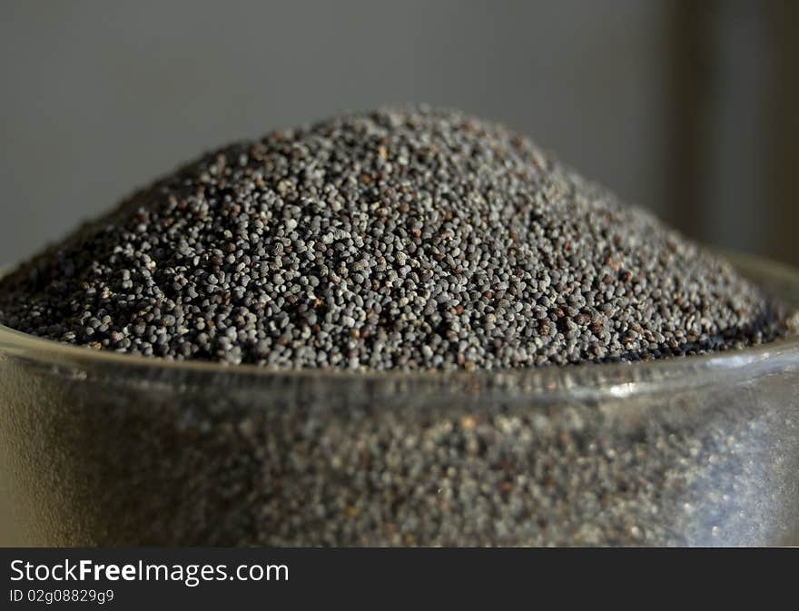 Poppy seeds in a glass tea-bowl