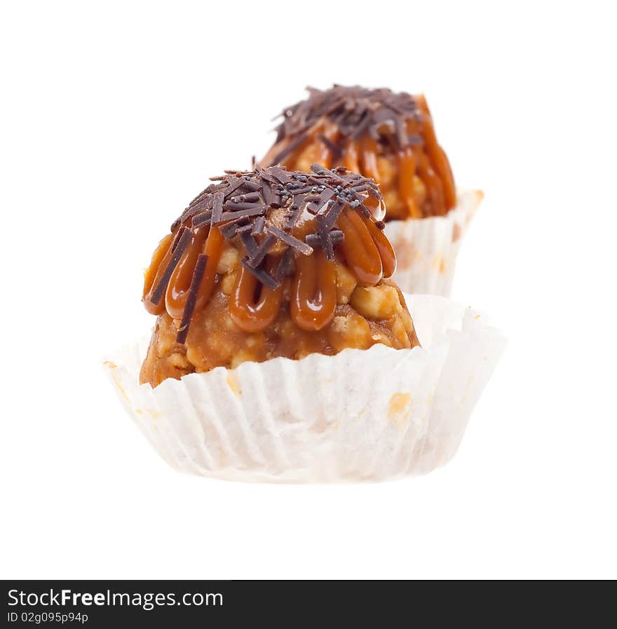 Two cakes with chocolate isolated on white