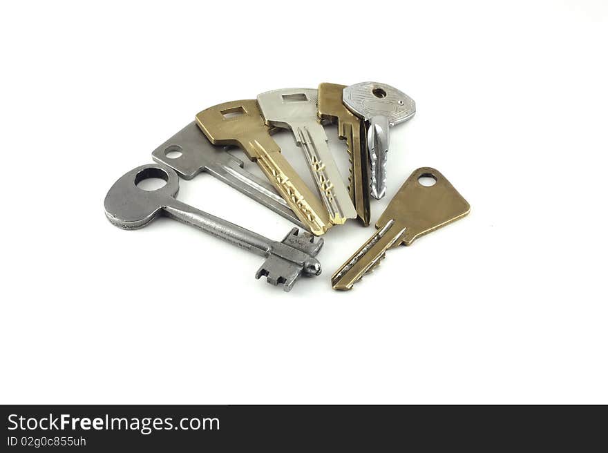 Collection of keys on the white background.