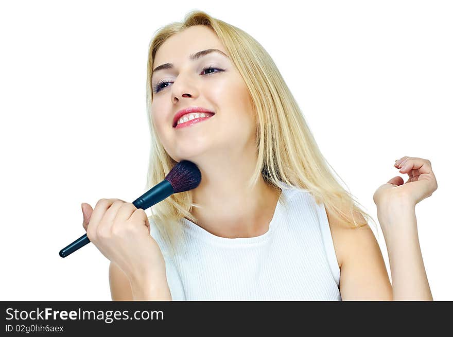 Beautiful girl with cosmetics brush on white. Beautiful girl with cosmetics brush on white