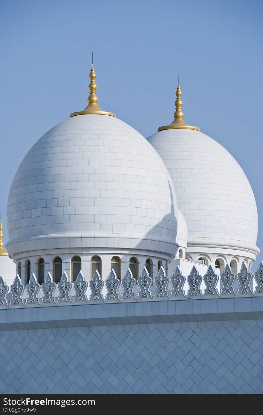 A pair of domes against clear skies