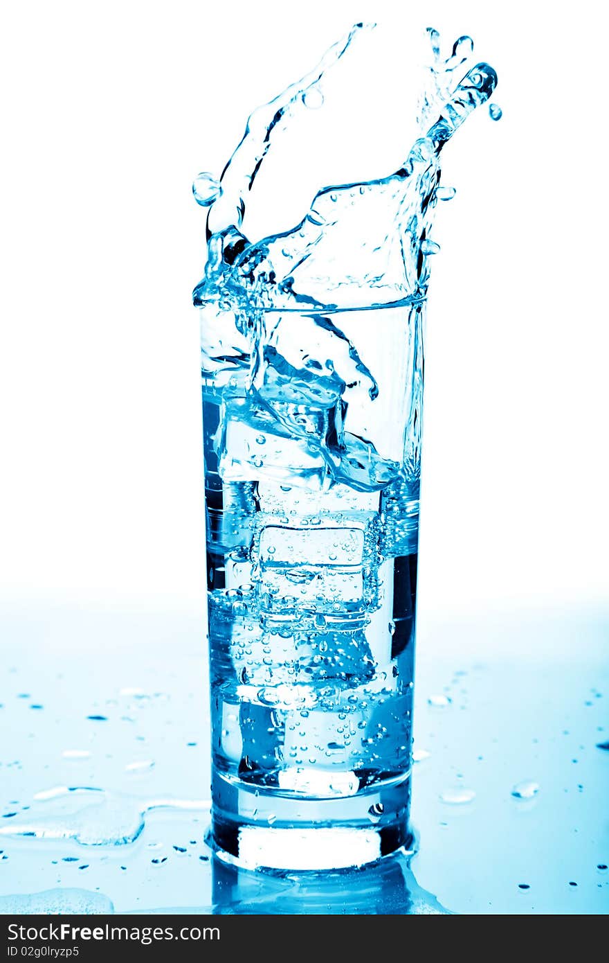 Water splashing in glass isolated over white