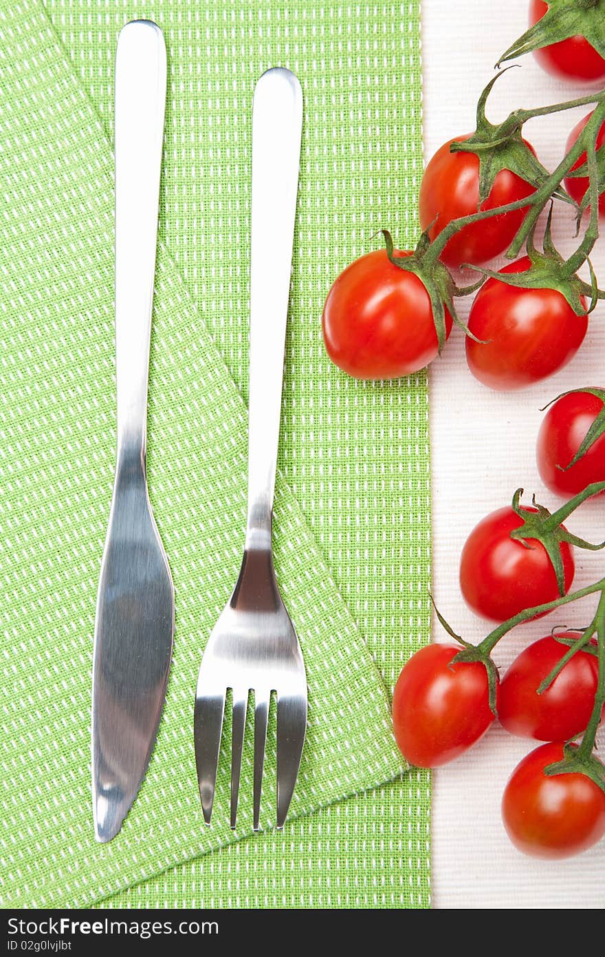 Fork knife and tomatoes