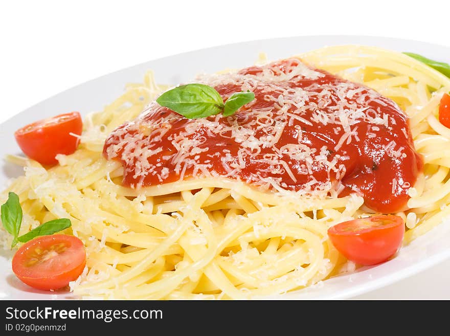 Pasta with tomato sauce and and basil on white background