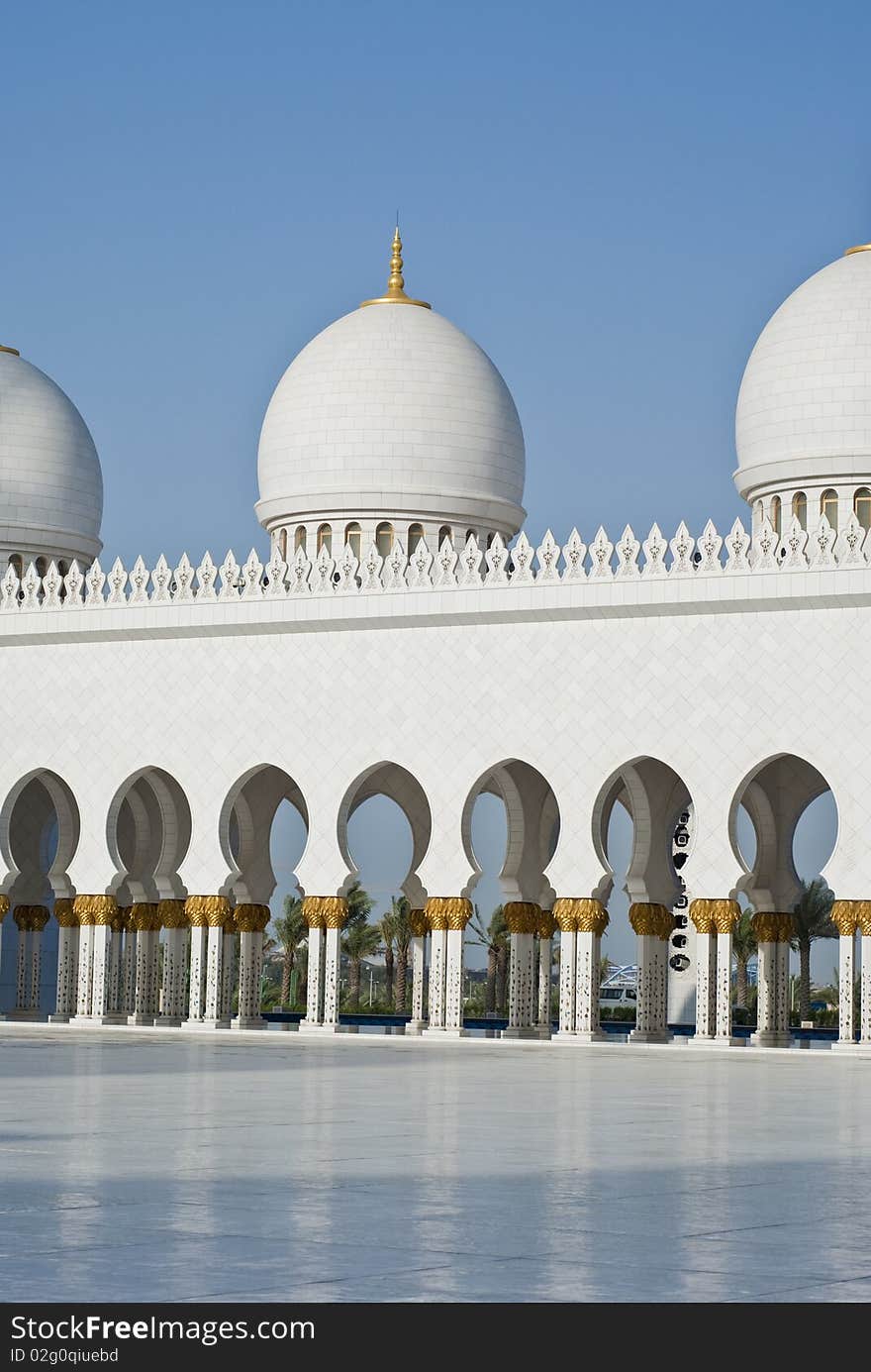 A series of arches at a courtyard of a mosque