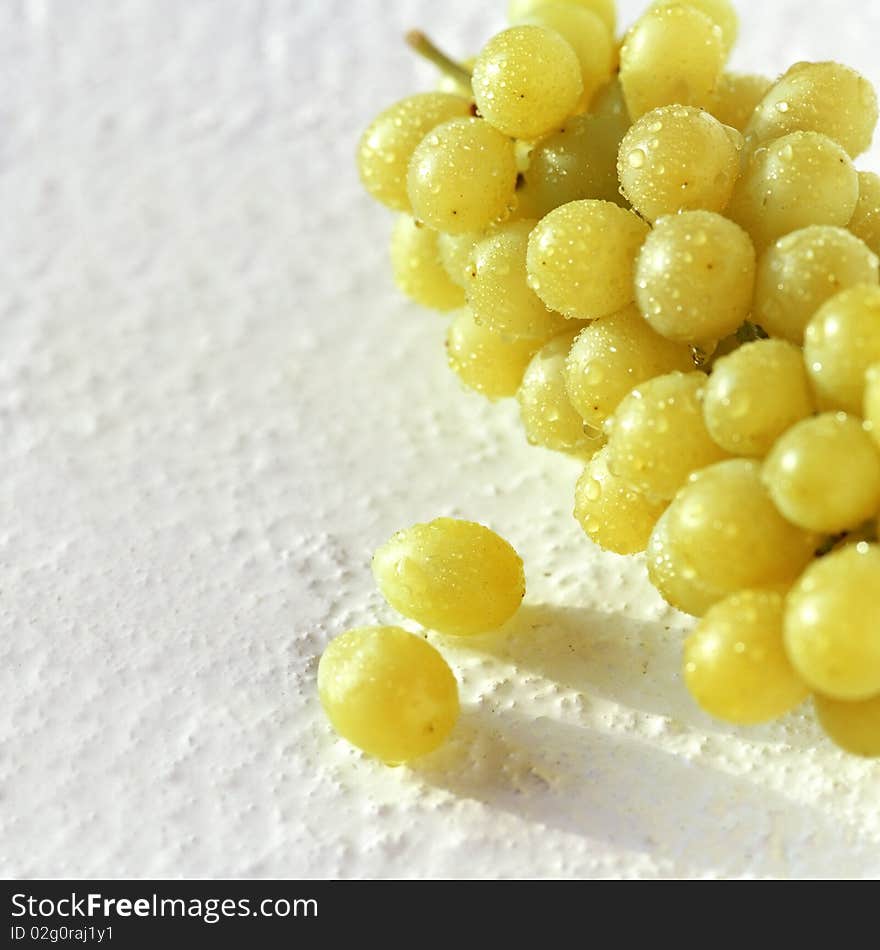 Green grapes on the impressive background