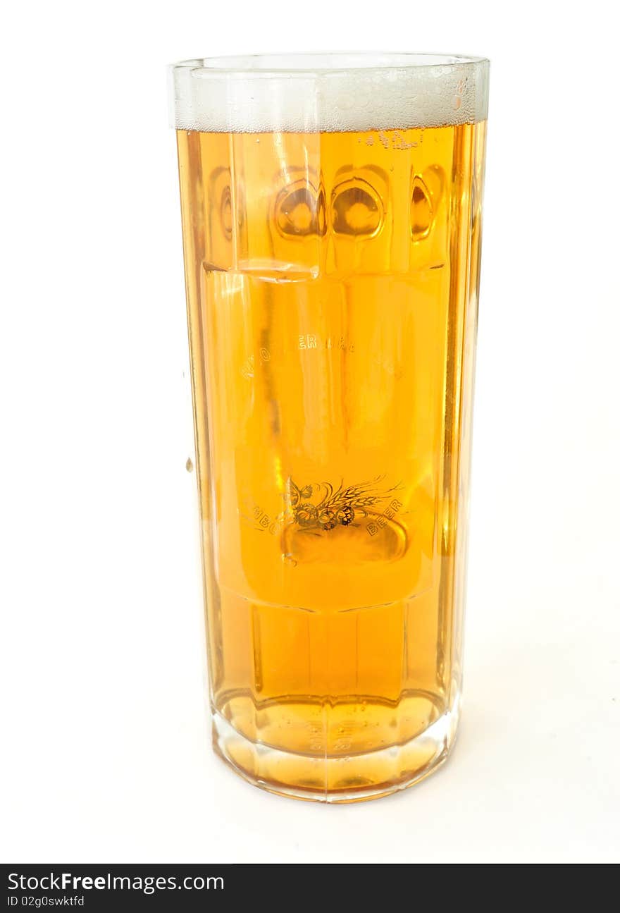 Image of a large glass of fresh beer with  white foam