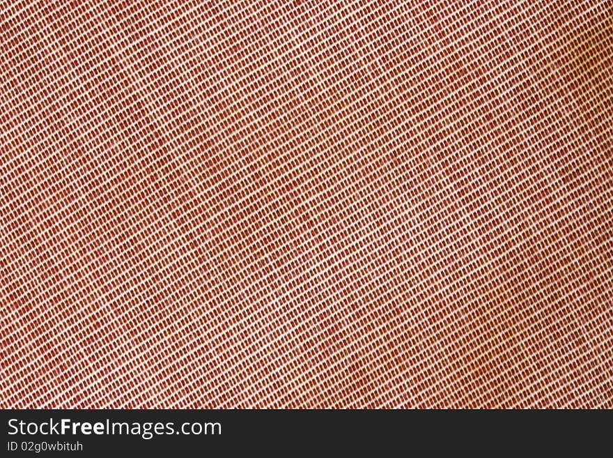 A background of pink textured fabric. A background of pink textured fabric