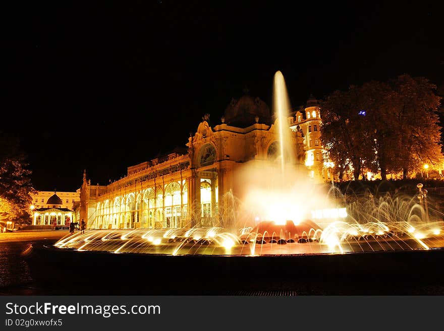 Night scenery of musical fountain show and the main cast-iron colonnade in Mariánské. Night scenery of musical fountain show and the main cast-iron colonnade in Mariánské