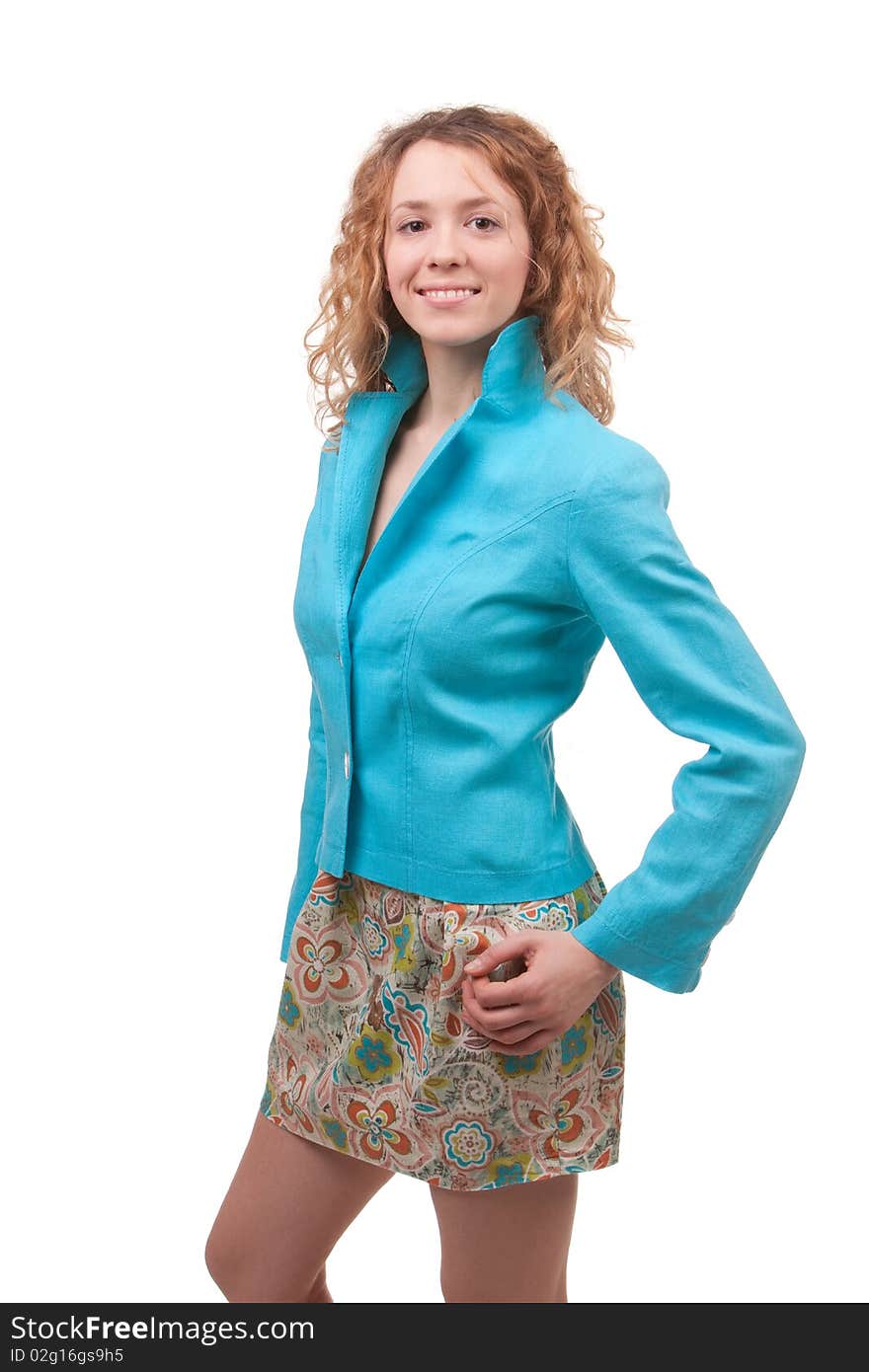 Young beautiful woman dressed in blue coat and colored skirt