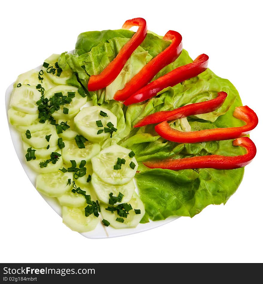 Cucumber slices with chive, lettuce and pepper on plate isolated over white background. Cucumber slices with chive, lettuce and pepper on plate isolated over white background.