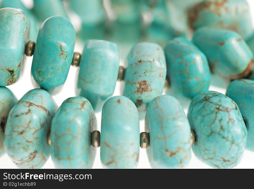 Beads with natural stone turquoise close-up. Beads with natural stone turquoise close-up