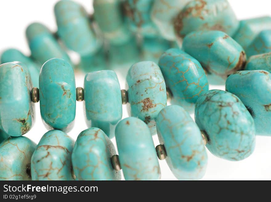 Beads with natural stone turquoise close-up. Beads with natural stone turquoise close-up