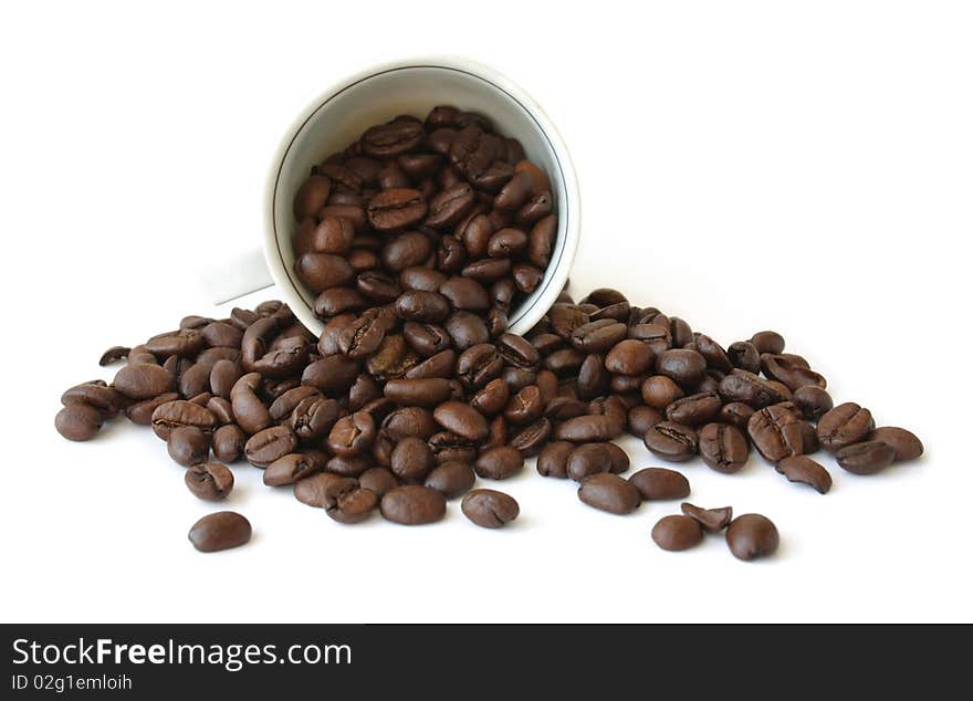 Cup with coffee beans on white background