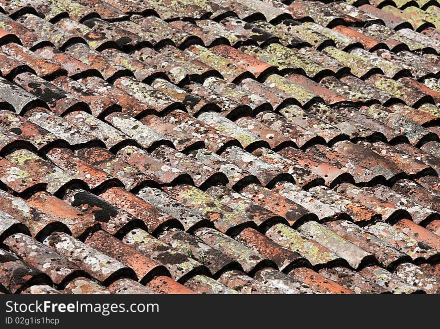 Beautiful old red tile with moss