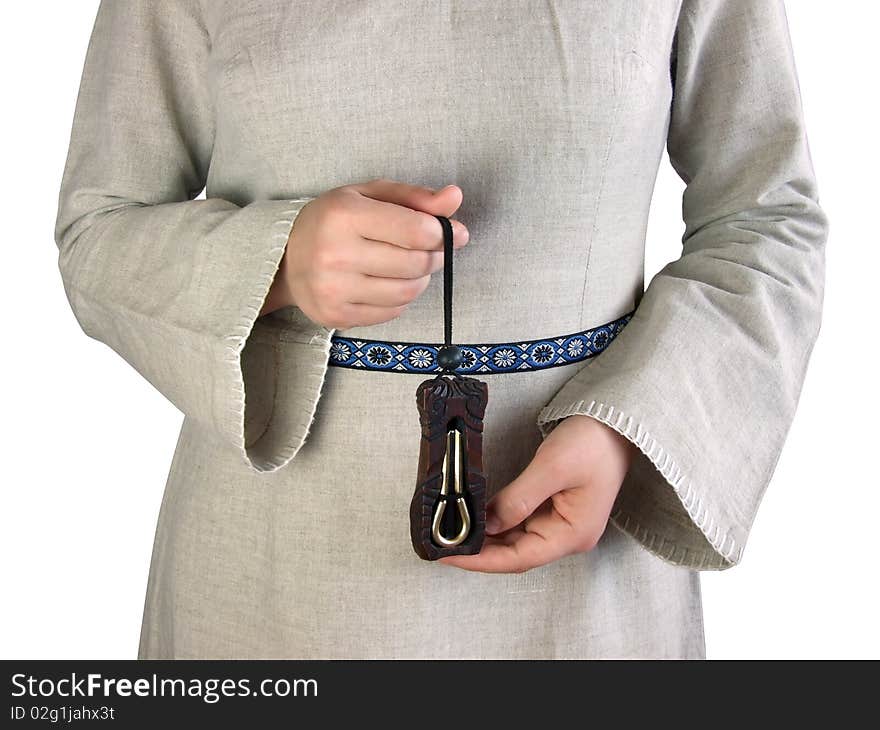 Girl in the ethnic dress hold in her hands a jews harp (mouth harp). Girl in the ethnic dress hold in her hands a jews harp (mouth harp).