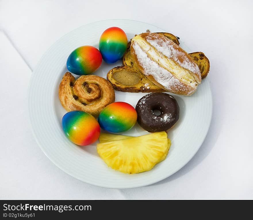 Easter plate with colored eggs and sweets