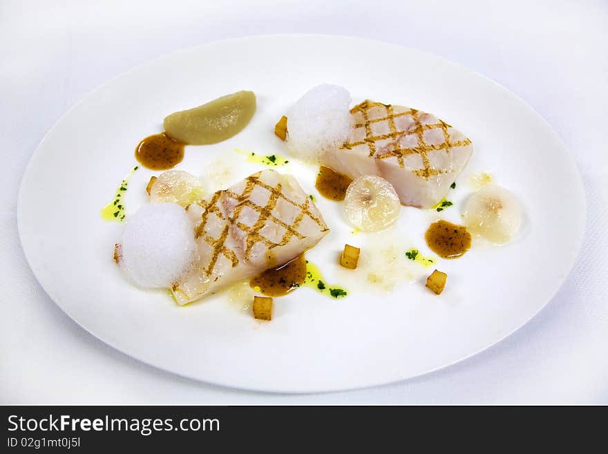 Roasted white fish on plate