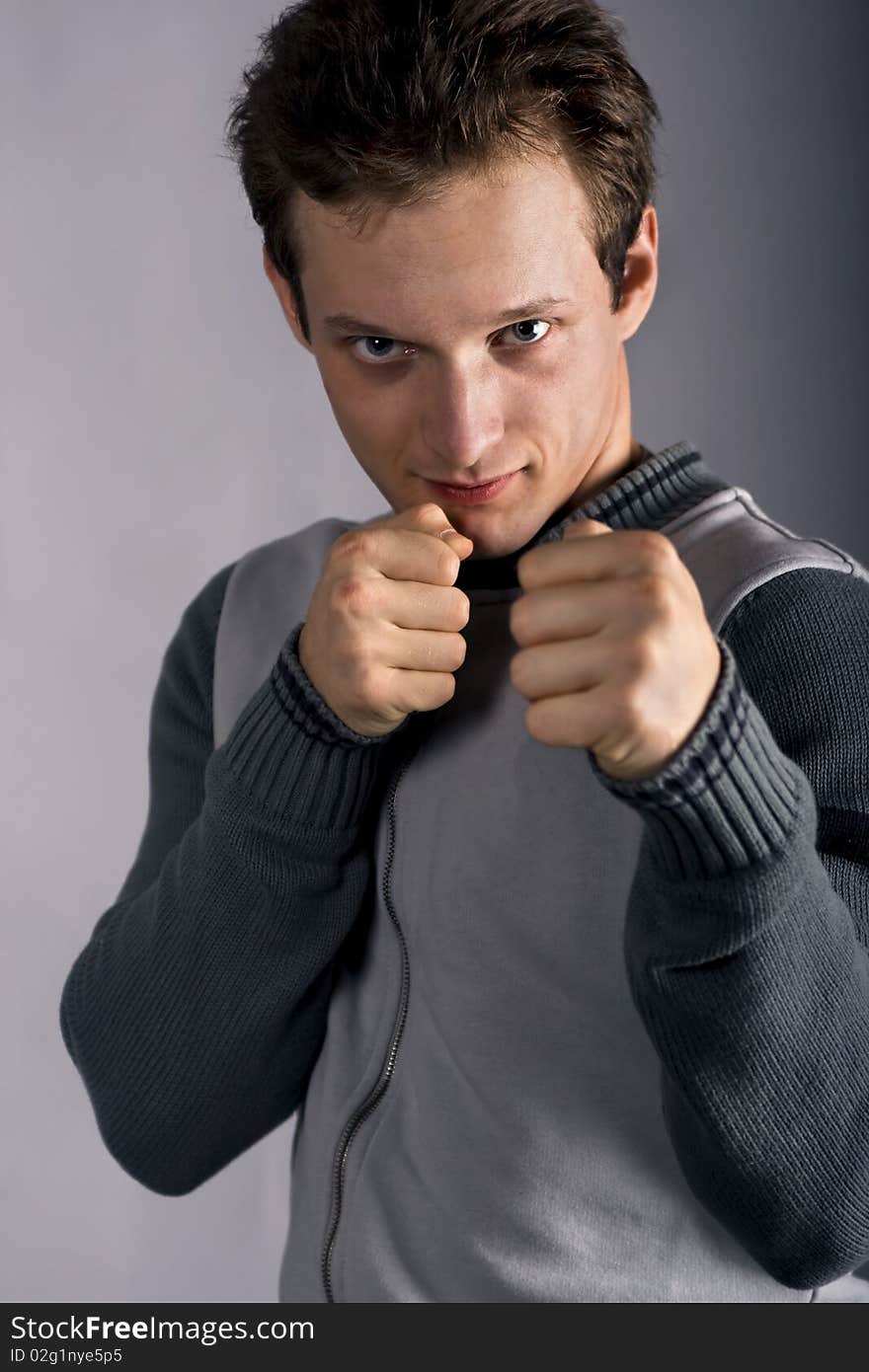 Young guy in a combat stance