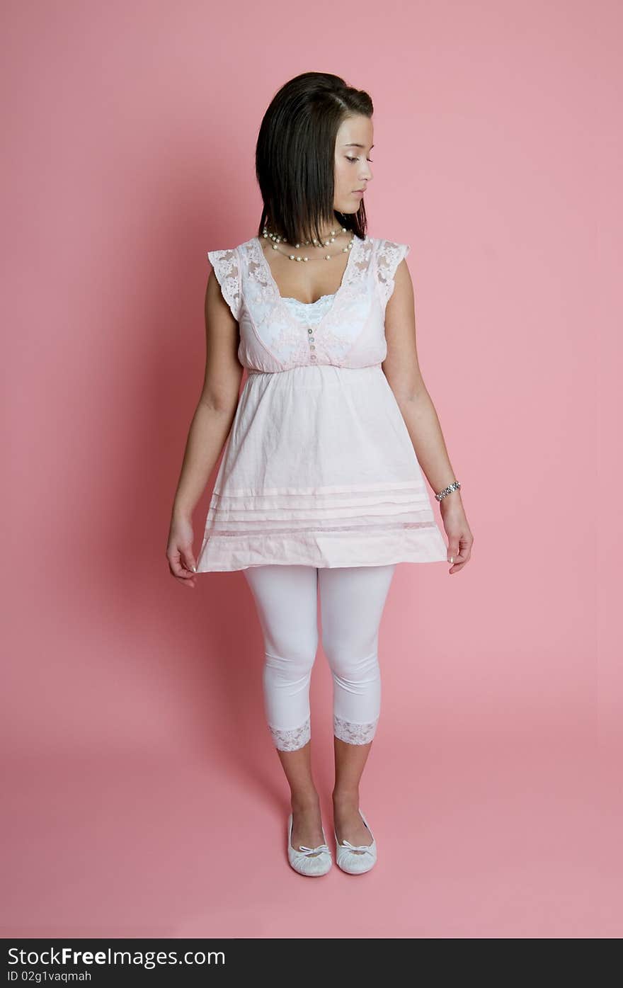 Young woman on pink background