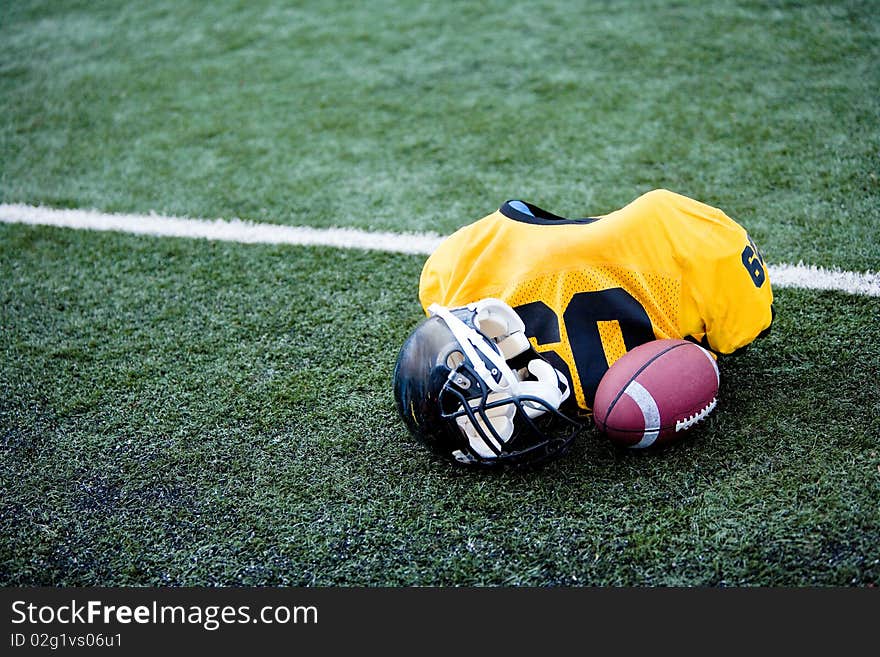 American football equipement on football field. American football equipement on football field