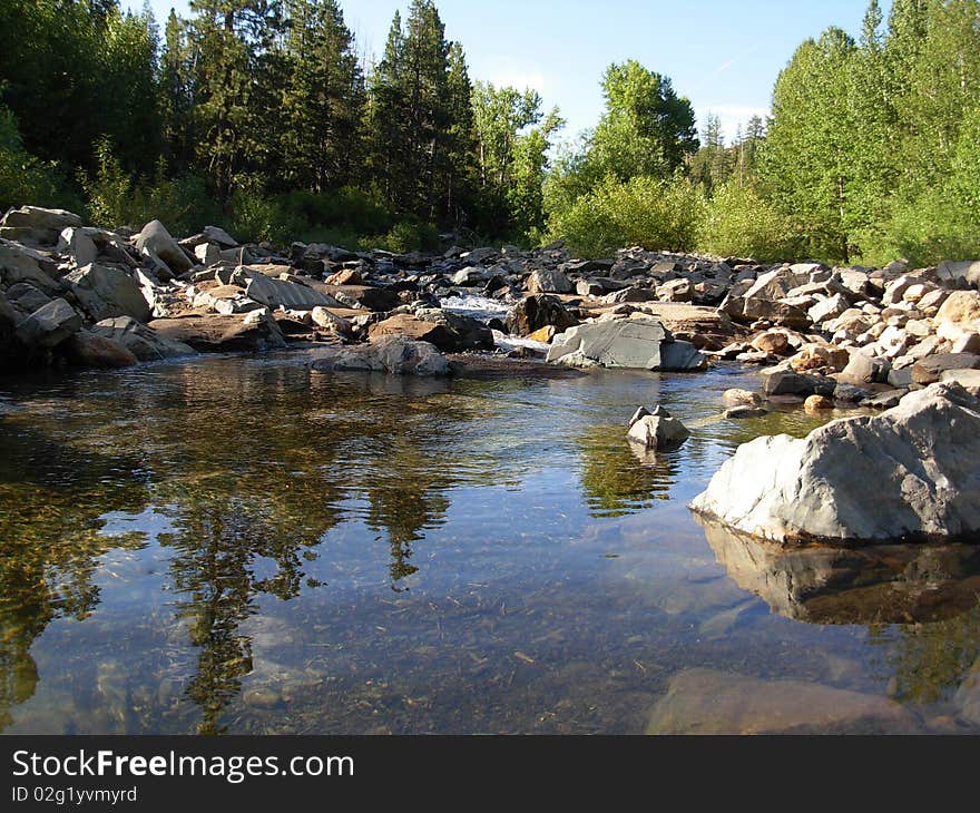 Rocky shoreline in high sierra mountain paradise. Rocky shoreline in high sierra mountain paradise