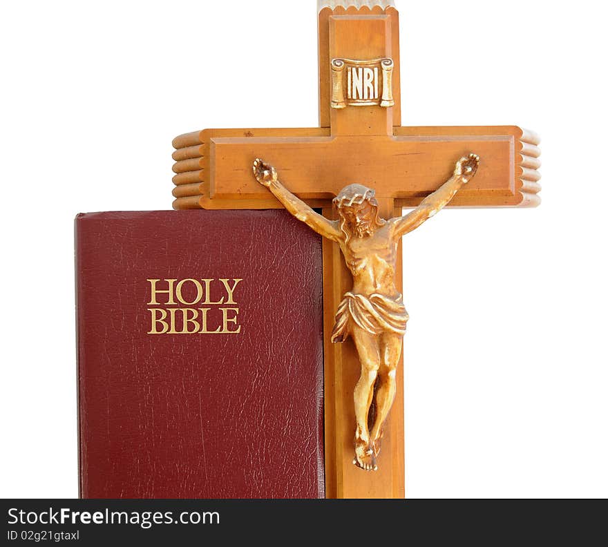 Holy Bible with a red leather cover isolated on a white background with crucifix. Holy Bible with a red leather cover isolated on a white background with crucifix