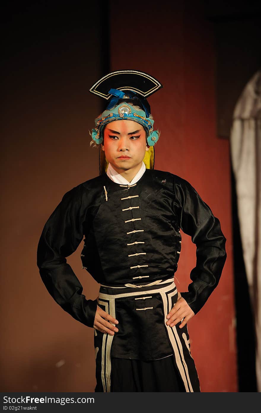 China opera actor with hat in black.