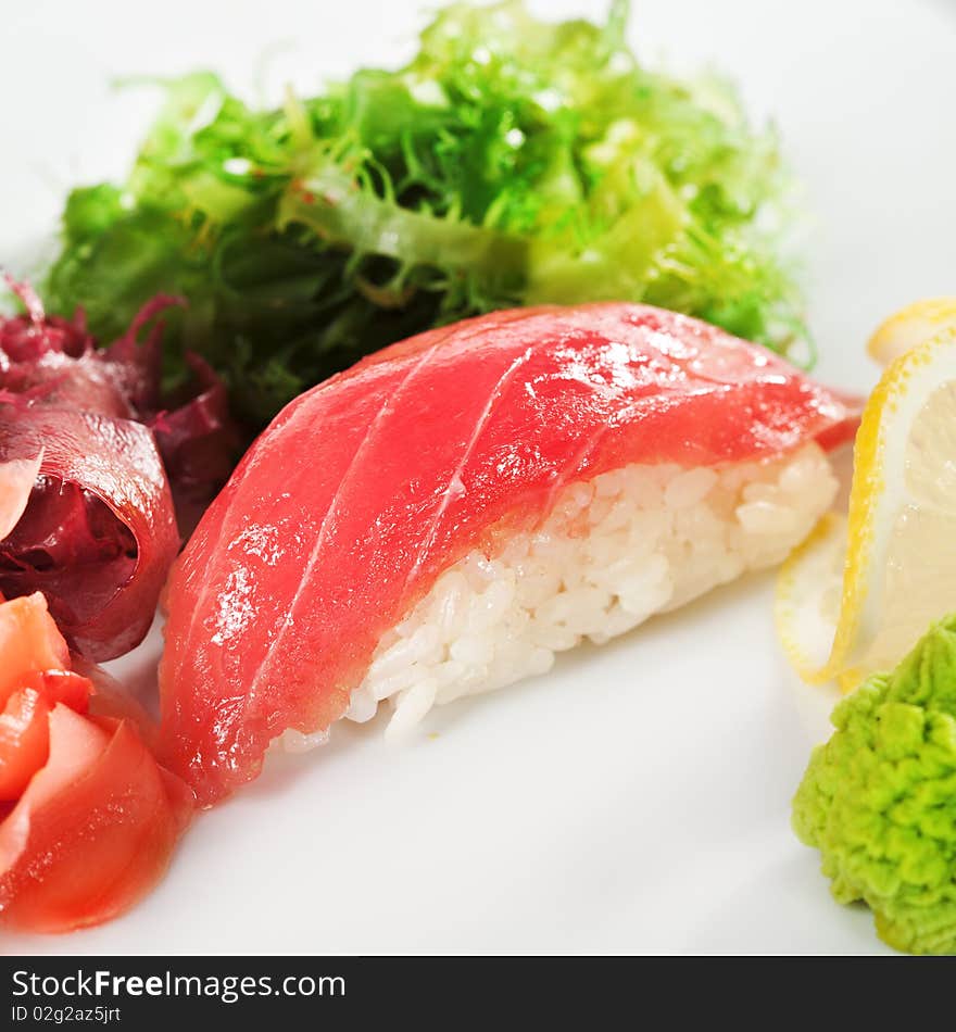 Japanese Cuisine -  Tuna (maguro)  Nigiri Sushi with Ginger and Seaweed. Japanese Cuisine -  Tuna (maguro)  Nigiri Sushi with Ginger and Seaweed