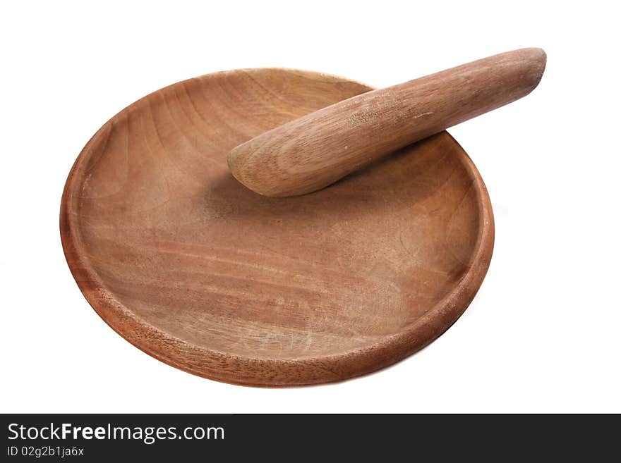 Wooden pestle and mortal traditionally used to grind chilies and herbs for cooking ingredients. Wooden pestle and mortal traditionally used to grind chilies and herbs for cooking ingredients.