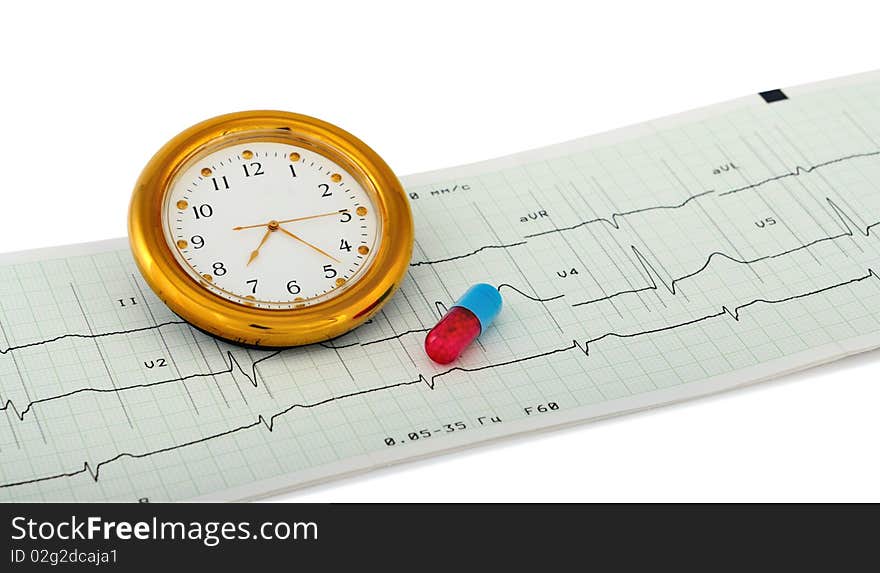 Pill and clock over an printout of a electrocardiogram report. Isolated on white with light shadow. The file includes a clipping path so it is easy to work with. Focus on figure six in clock. Pill and clock over an printout of a electrocardiogram report. Isolated on white with light shadow. The file includes a clipping path so it is easy to work with. Focus on figure six in clock.