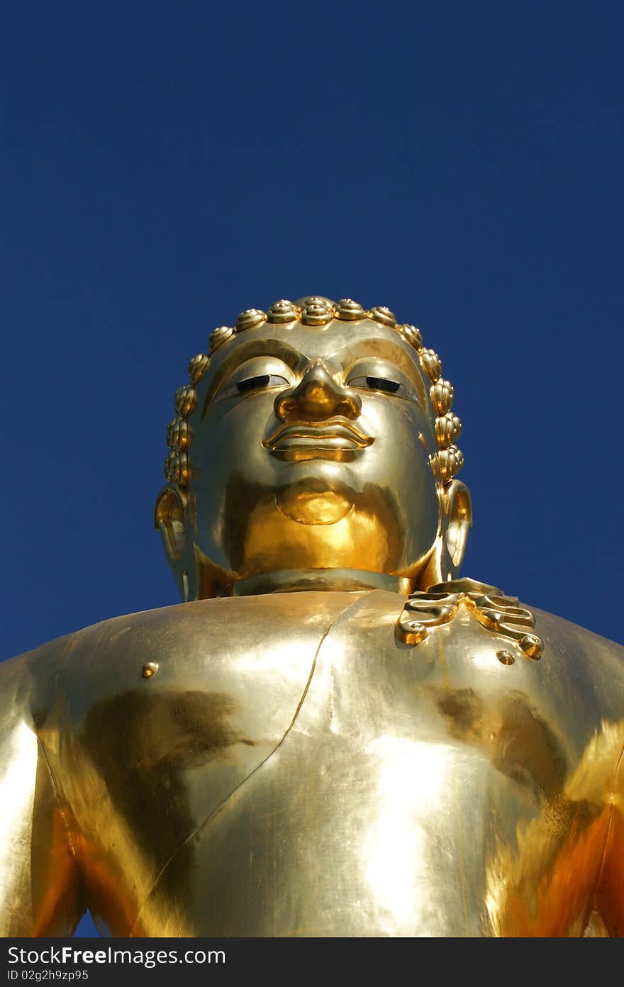 Golden Buddha in the attitude of subduing Mara manner located at golden triangle, Ching San, Thailand. Golden Buddha in the attitude of subduing Mara manner located at golden triangle, Ching San, Thailand