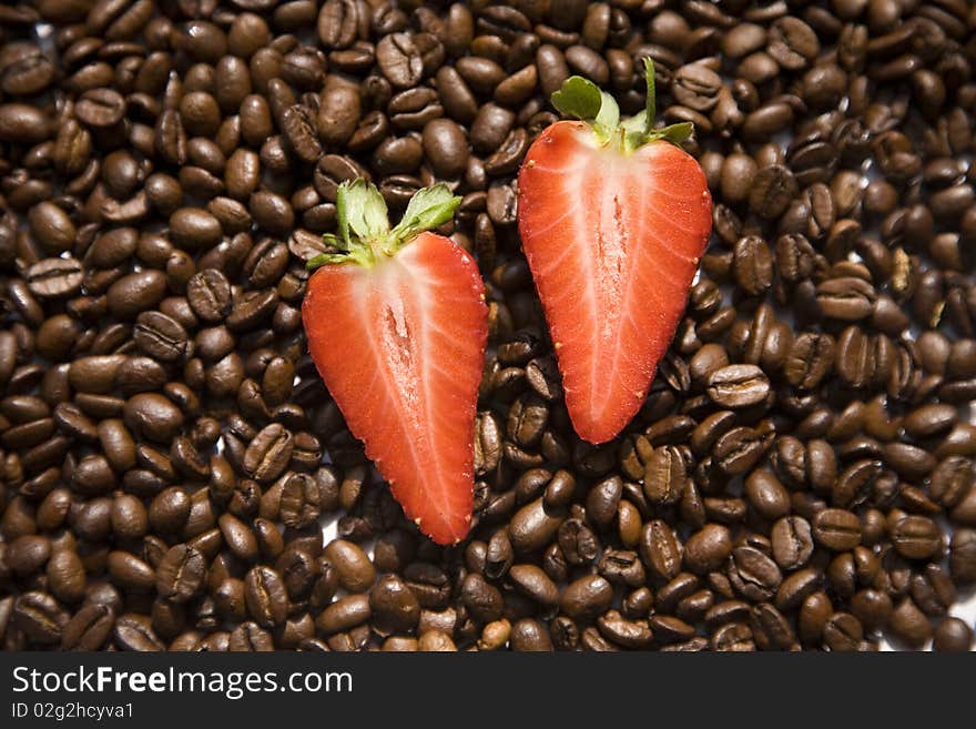 Strawberry on coffee beans texture. Strawberry on coffee beans texture