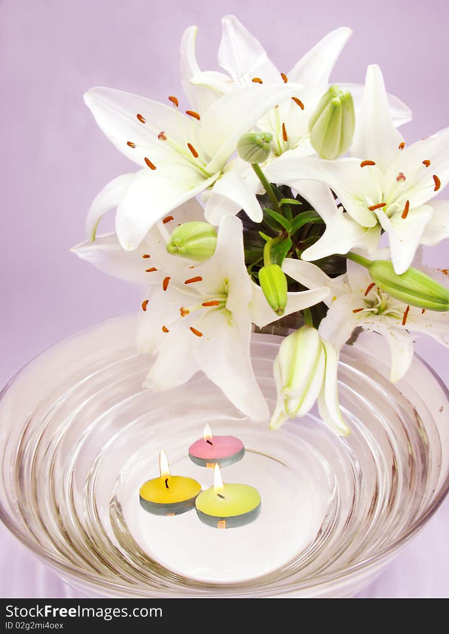 Spa lit candles lilies flowers health-care treatment. Spa lit candles lilies flowers health-care treatment