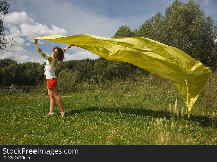 Woman holds in hand developing on wind fabric