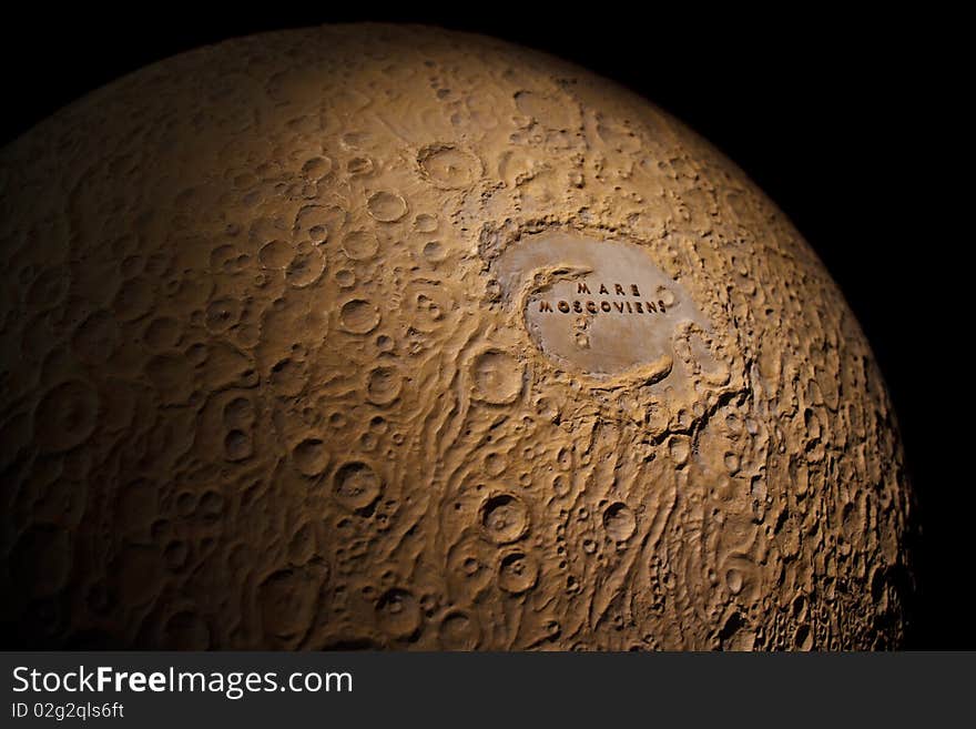 Space Museum. Moon Globe - a model of the moon with craters. Isolation.