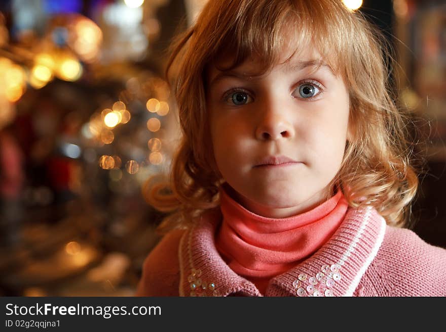 Portrait Of Little Girl In Background Lights