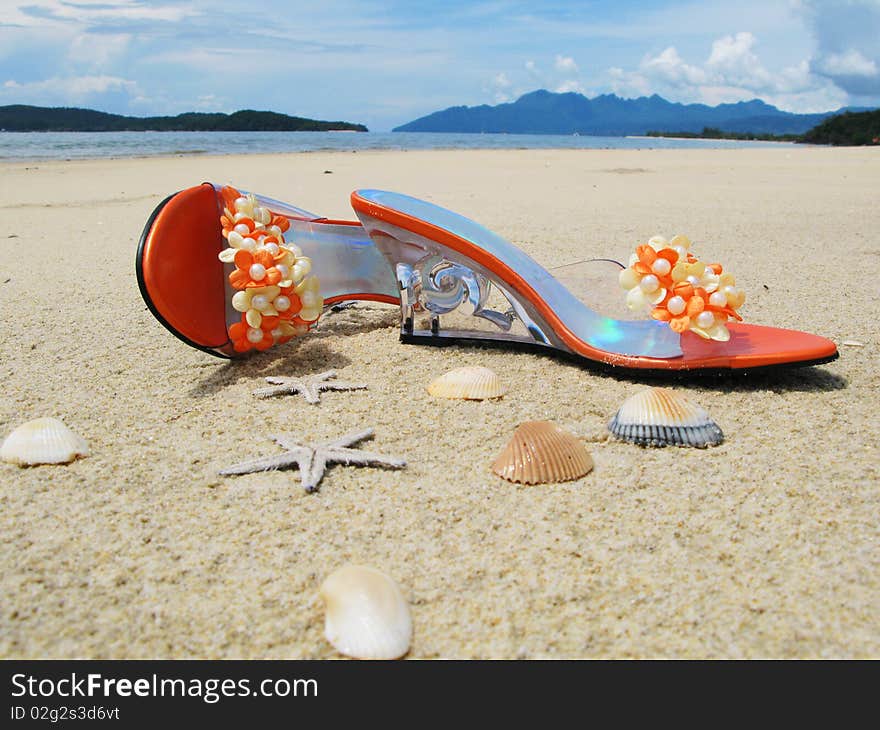 Trandy shoes on the sand of Langkawi island, Malaysia