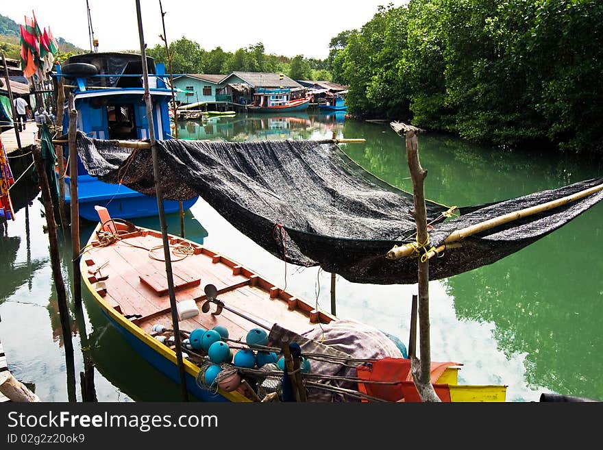 Fish will be dried in a fisherboat in a small fishermans village in Koh Chang, Thailand