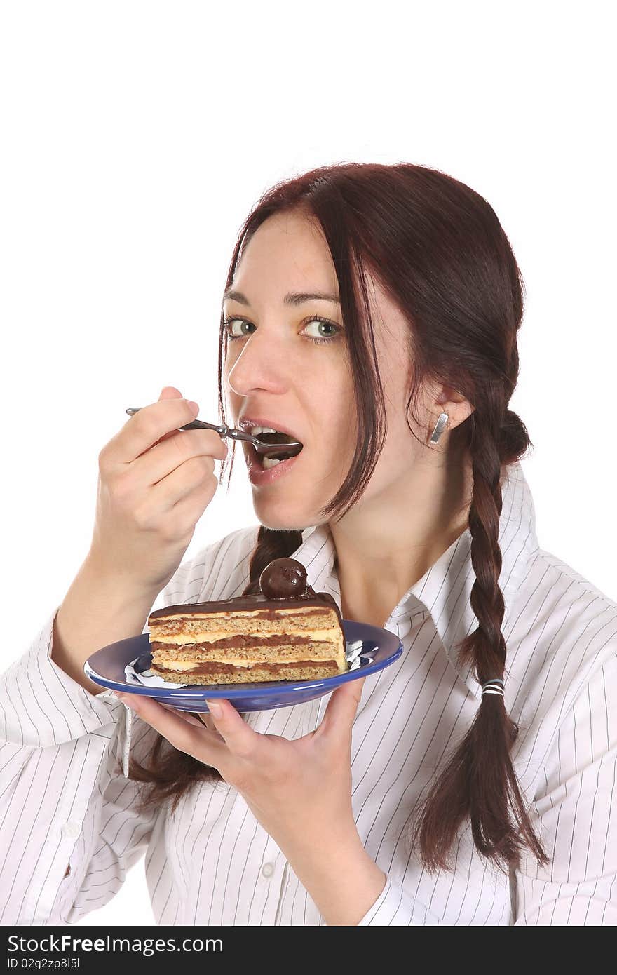 Beautiful woman eating piece of cake