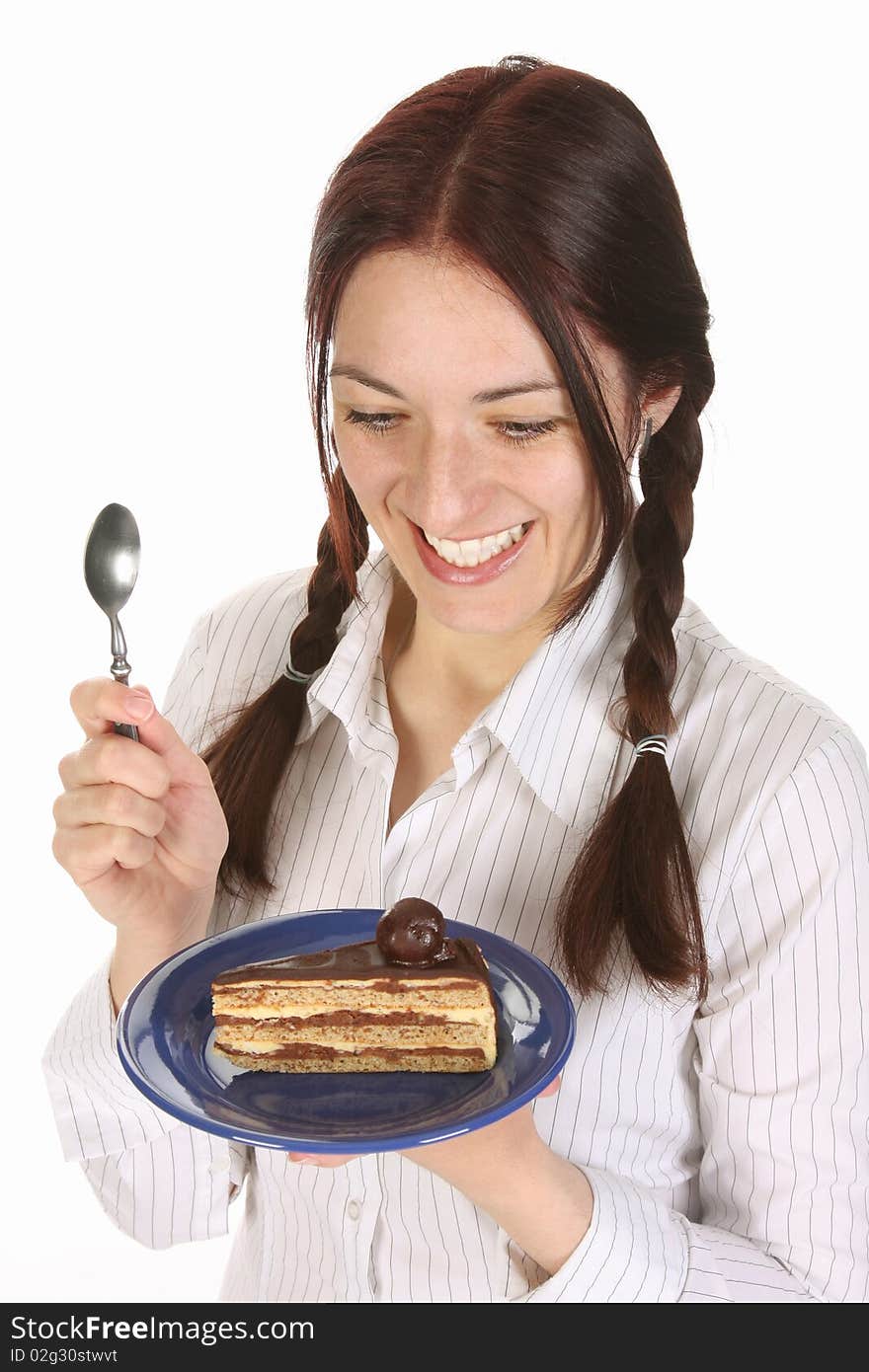 Beautiful woman eating piece of cake on white background