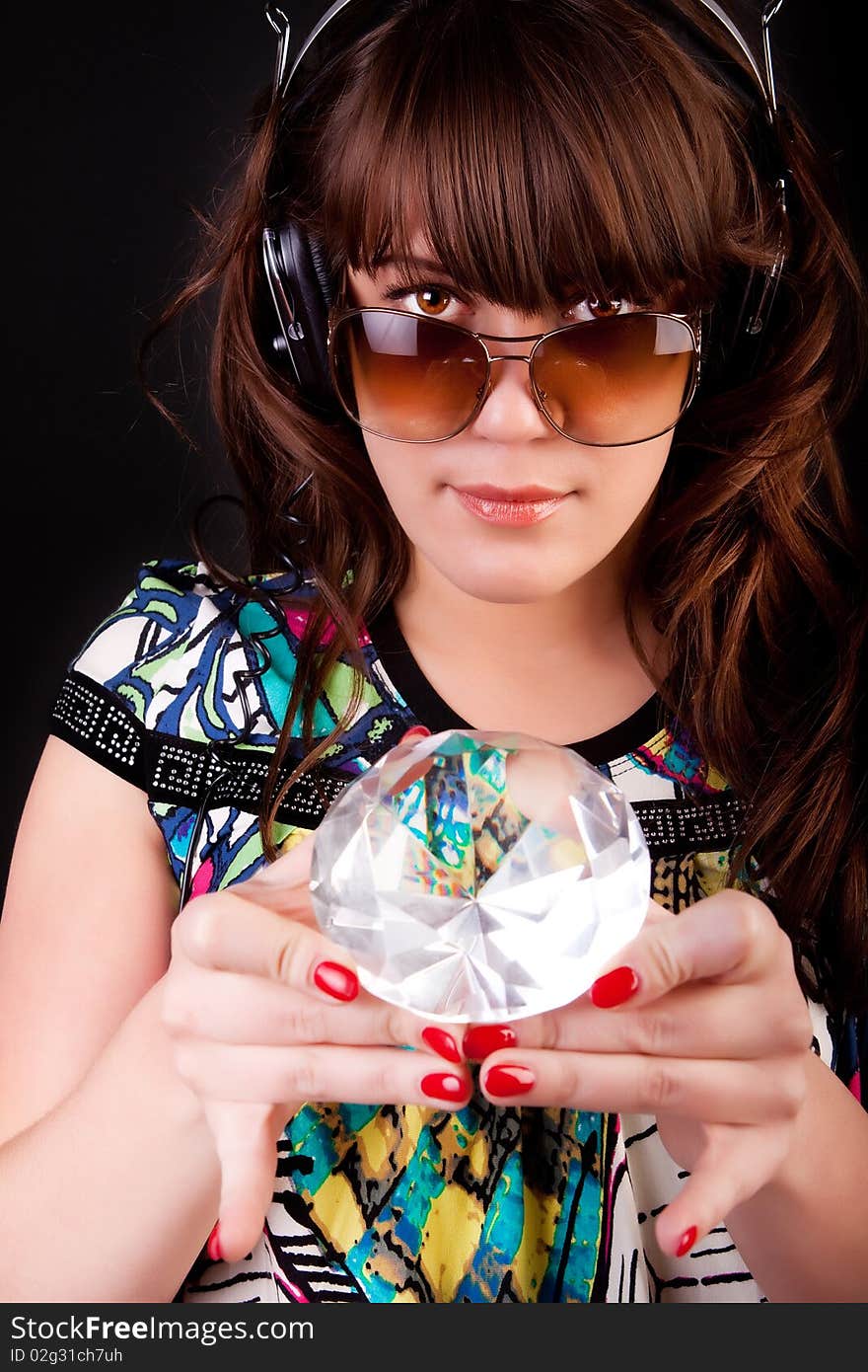 Picture of young woman with headphones and gem. Picture of young woman with headphones and gem