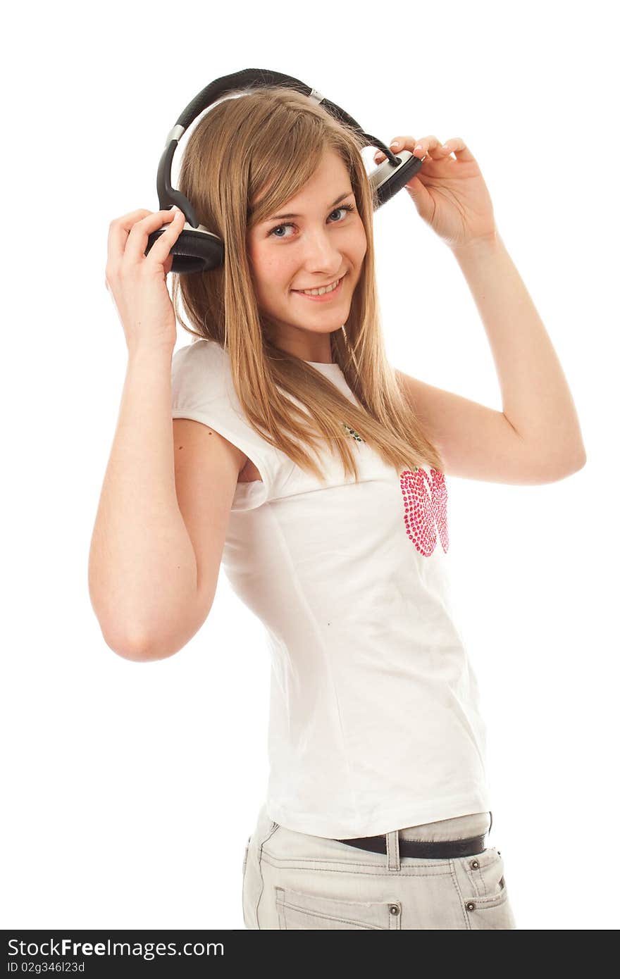 The young beautiful girl with headphones isolated on a white background