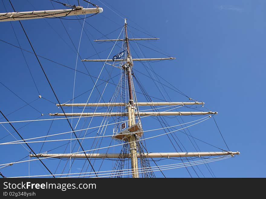 White mast with rigging, ropes and fore top