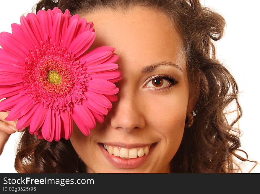 Beautiful young woman with curly long hairs and bright flower. Beautiful young woman with curly long hairs and bright flower