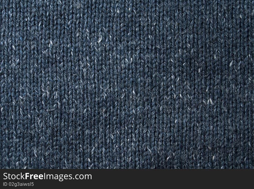 Woolen knitted sweater of dark blue color. Woolen knitted sweater of dark blue color