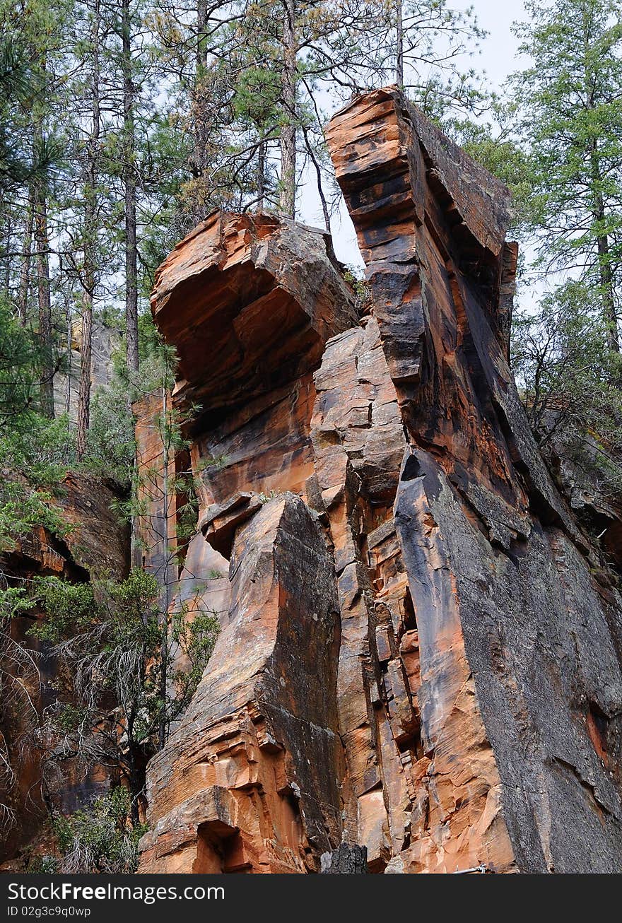 Red rock mountain looking like transformer character in Oak Creek Canyon near Sedona, Arizona. Red rock mountain looking like transformer character in Oak Creek Canyon near Sedona, Arizona.