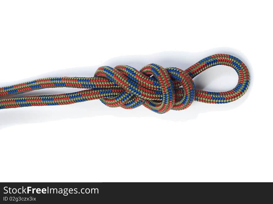 Coloured rope bundled up on white background